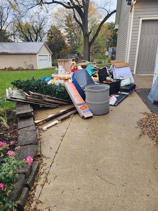 Dumpster being loaded with debris for 3 Yard Dumpster Rental in Lafayette